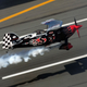 Illustration for article titled Racing A Lambo In A Biplane Is The Pitts